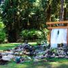 River Rock natural stone waterfalls into koi pond. Enchanted Elopement site
